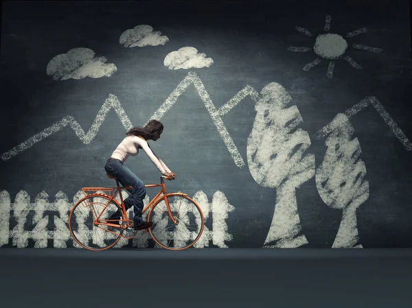 Young woman with a bicycle — Stock Photo, Image