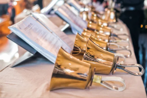 Handbells with sheet of music — Stock Photo, Image