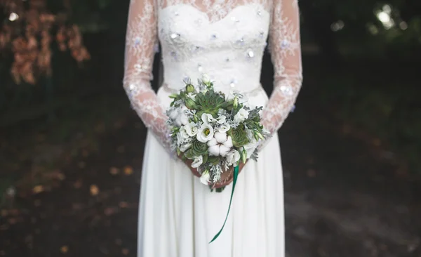 Bride holding wedding bouquet