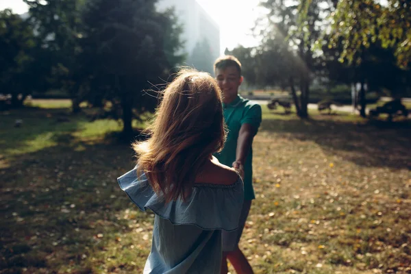 Man and woman in the park — Stock Photo, Image