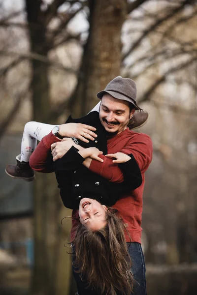 Dad holding his daughter upside down — Stock Photo, Image