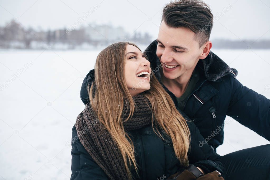 couple sitting on the snow