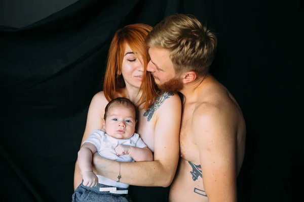 Happy family on a black background — Stock Photo, Image