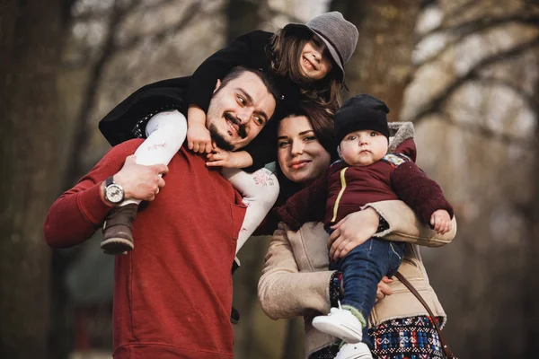 Happy family in the autumn park — Stock Photo, Image