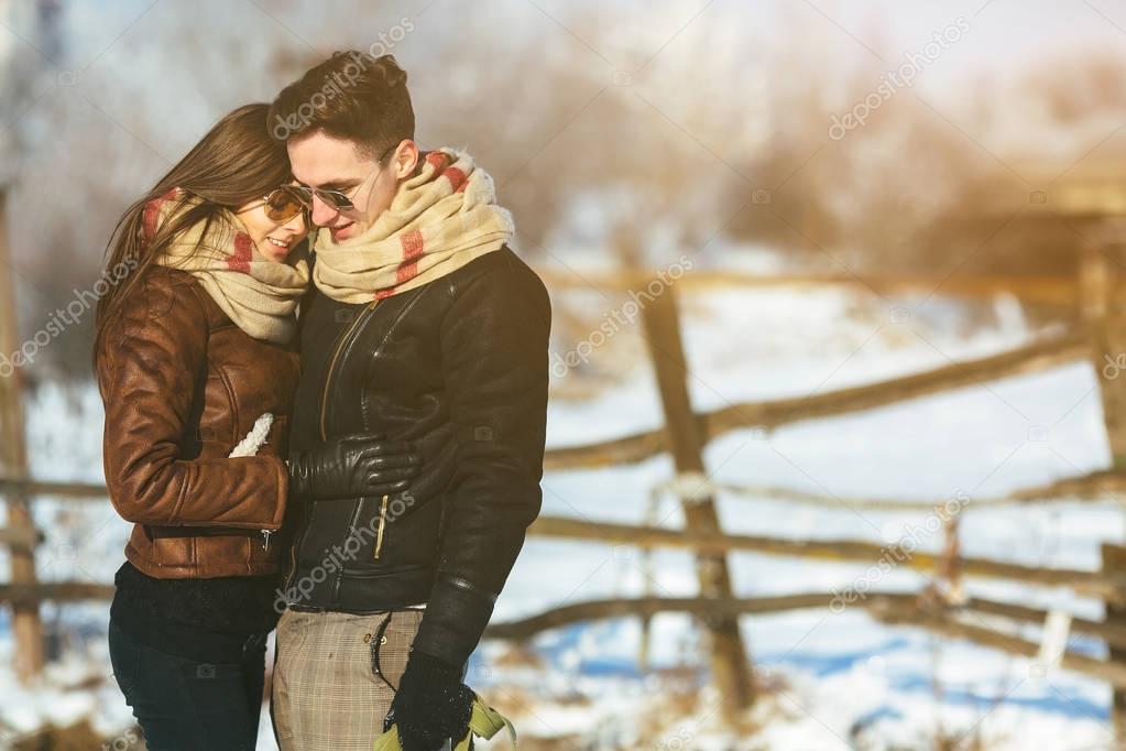 Happy couple in snow park