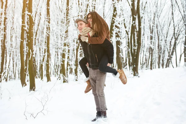 Happy couple playful together in snow park — Stock Photo, Image