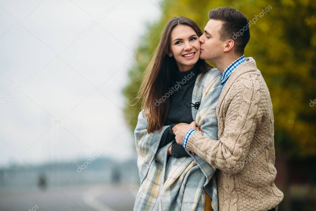 smiling couple in autumn park