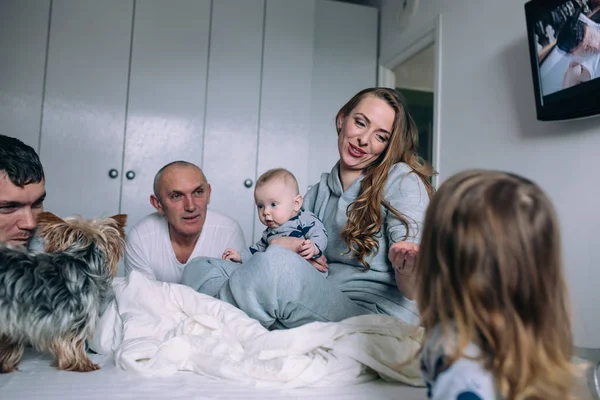 Family playing on bed in the bedroom — Stock Photo, Image