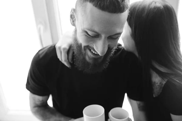 Couple on the background of a window — Stock Photo, Image