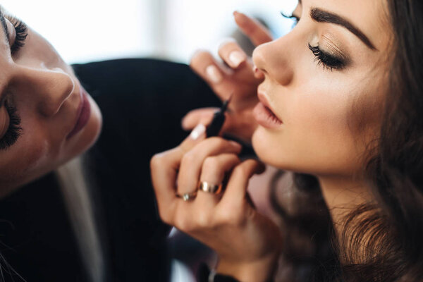 Makeup and hairstyle for a beautiful model