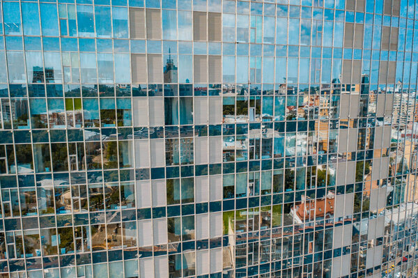 Street reflection on glass steel building facade, close view