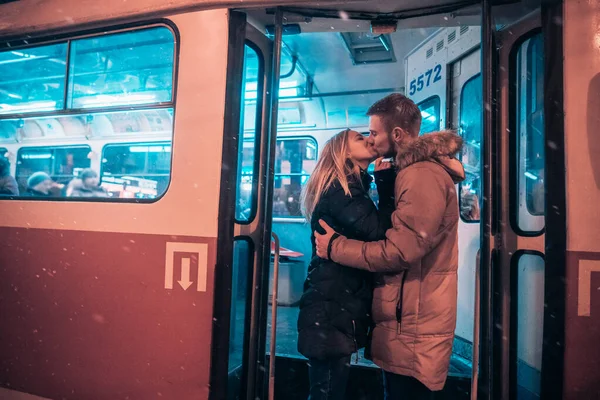 The guy and the girl kiss on the tram — Stock Photo, Image