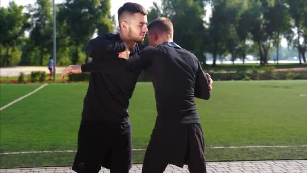 Two fighters practice mma skills in training — Stock Video