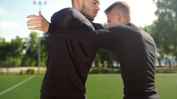 Two fighters practice mma skills in training — Stock Video