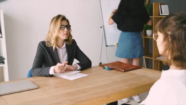 Young female candidate interviewed by employer — Stock Video