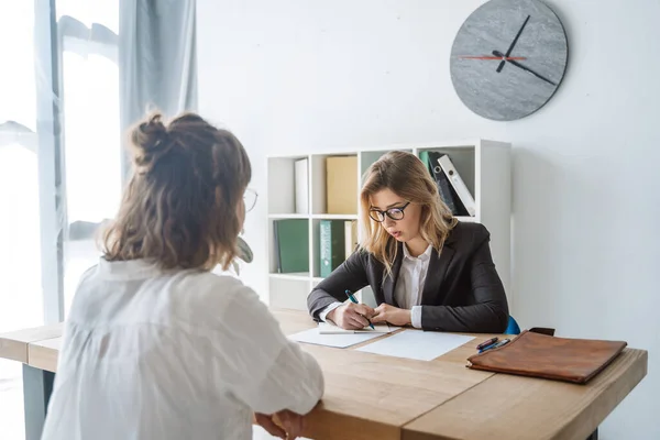 Young female candidate interviewed by employer — Stock Photo, Image