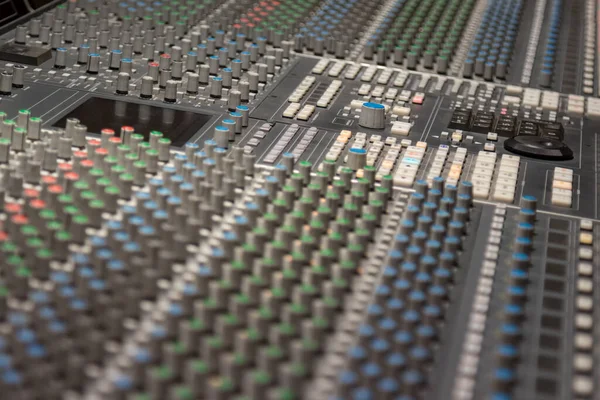 Sound settings on the mixing desk of a recording studio.