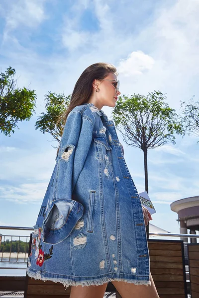 Street style look woman sexy girl wear denim jeans jacket brunet