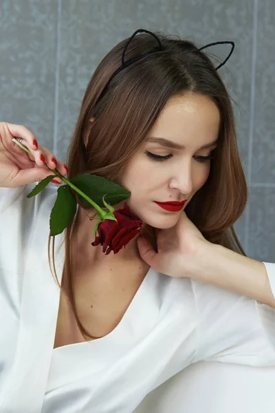 Sexy woman in bathroom in silk robe rose Valentine's day — Stock Photo, Image