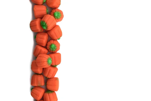 Candy Pumpkins in Vertical Row on Isolated White — Stock Photo, Image
