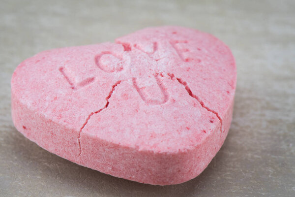 Close Up of Cracked Love U Candy Heart