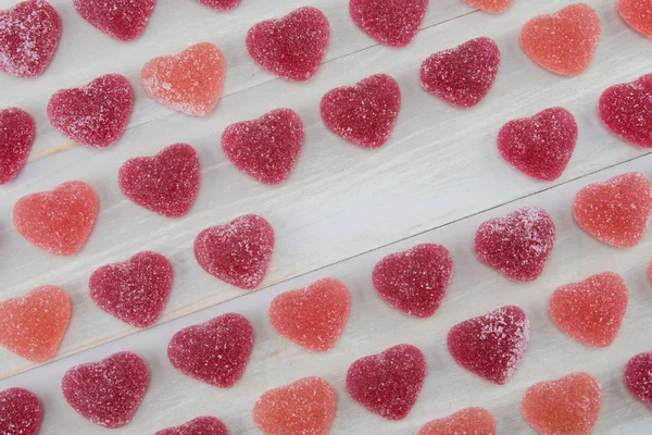 Angled Rows of Dark Red and Pink Gummy Hearts with Empty Text Sp — Stock Photo, Image