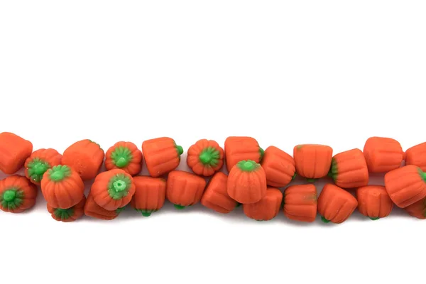 Candy Pumpkins in Row on Isolated White — Stock Photo, Image