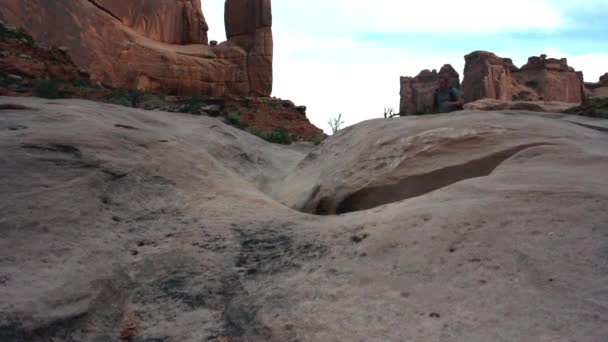 Arches Man Run Towards Camera Over Slickrock — Stock Video