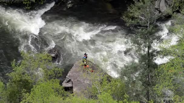 Photographer and Kayaker Passes By — Stock Video