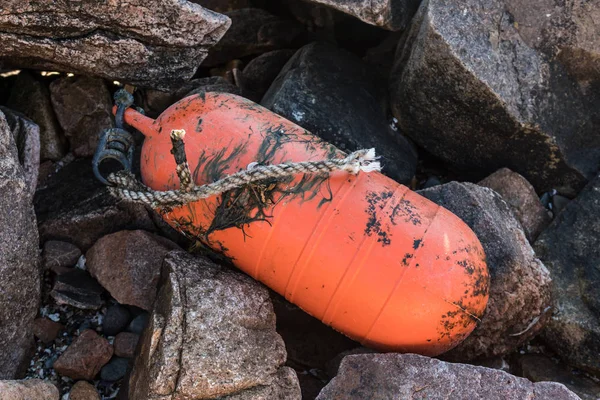 Moss Covered Orange Buoy on Rocks — Stock Photo, Image