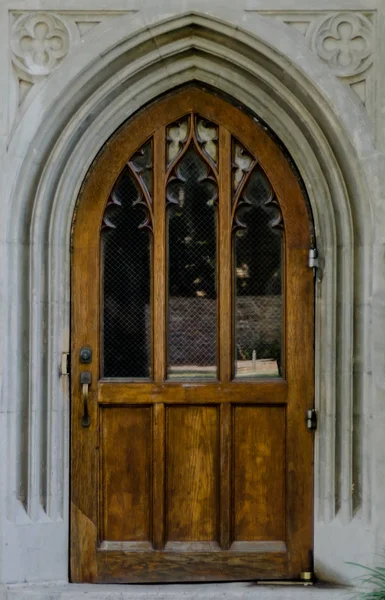 Wooden Door in Stone Archway — Stock Photo, Image