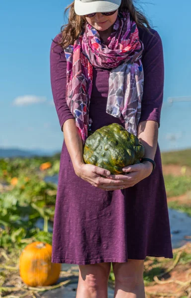 Close Up of Woman Holding Bumpy Pumpkin — Stock Photo, Image