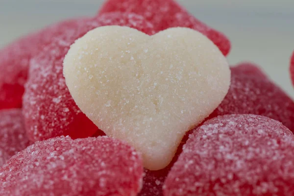 White Gummy Heart of Pile of Red Gummy Hearts — Stock Photo, Image