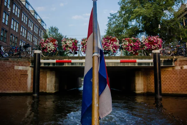View of Netherlands Flag on back of Canal — Stock Photo, Image