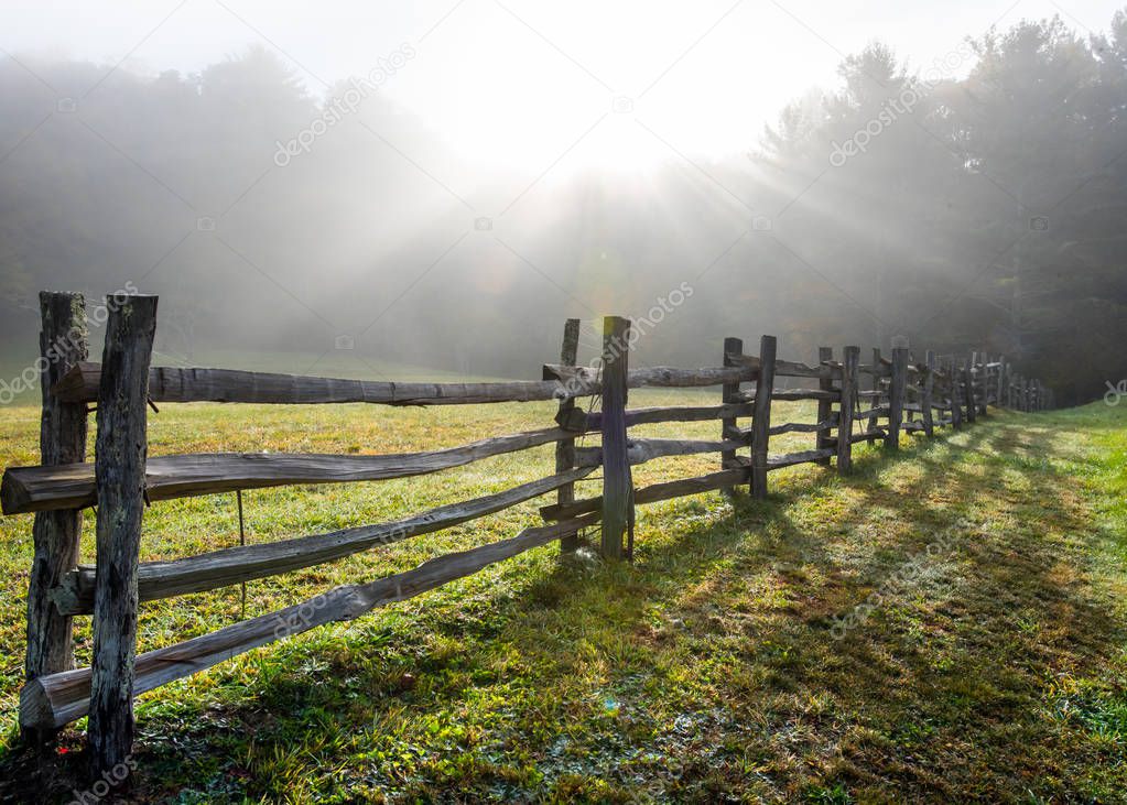 Sun Rays in Foggy Field and Split Rail Fence