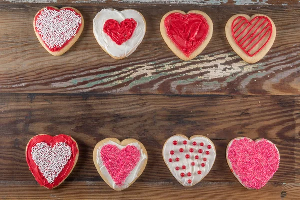 Two Lines of Decorated Heart Shaped Cookies — Stock Photo, Image