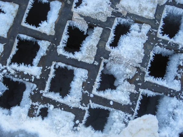 Snow and Ice on Square Grate — Stock Photo, Image