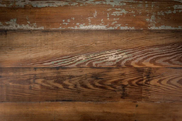 Изношенная краска на деревянном столе — стоковое фото