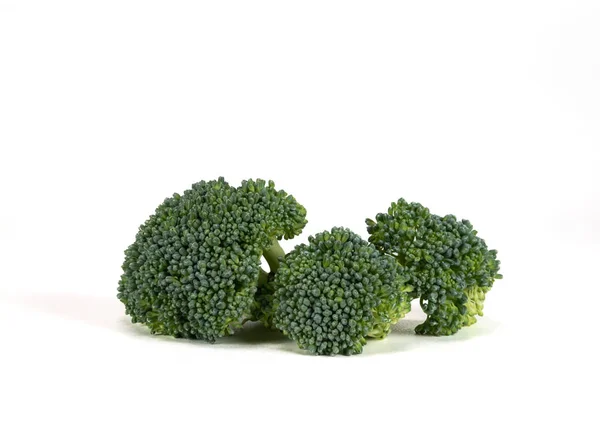 Tres pedazos de brócoli — Foto de Stock