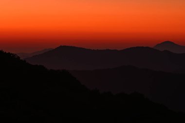 Orange Morning Sky Over Ridges