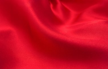 Arkaplan olarak kırmızı saten veya ipek kumaş
