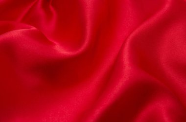 Arkaplan olarak kırmızı saten veya ipek kumaş
