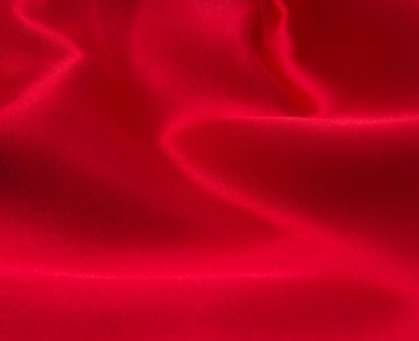 Arkaplan olarak kırmızı saten veya ipek kumaş