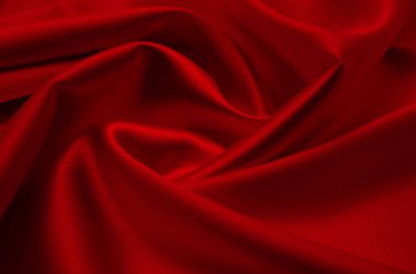 Arkaplan olarak kırmızı saten veya ipek kumaş