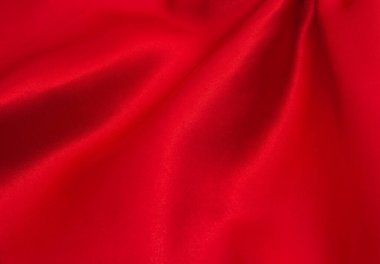 Arkaplan olarak kırmızı saten veya ipek kumaş