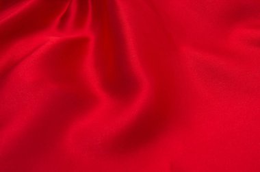 Arkaplan olarak kırmızı saten veya ipek kumaş