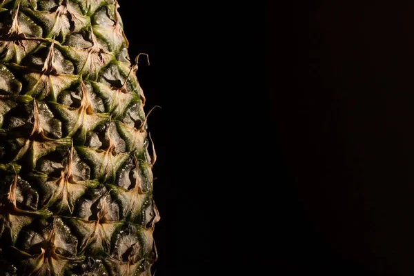 Pineapple Makro with black background and copy space