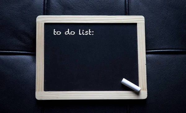 To do list written on chalk board — Stock Photo, Image