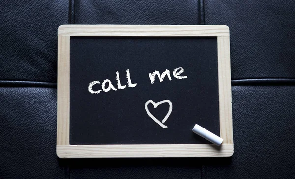 Call me written on black chalk board — Stock Photo, Image