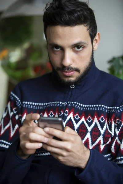 Portrait of handsome man with phone in his hand — Stock Photo, Image